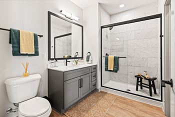 A bathroom with a white toilet and a white sink.